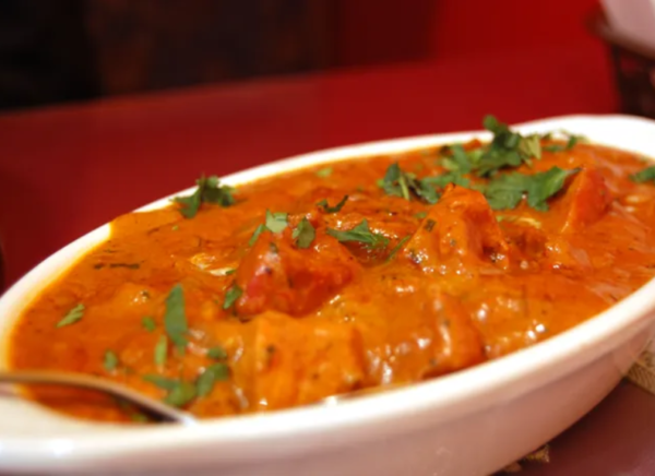 Butter Chicken Halal Boneless Chicken Thigh Meat Marinated in Yogurt, sour cream Spice and then Slow cooked the meat in buttery onion tomato curry, on the sweeter creamy side.