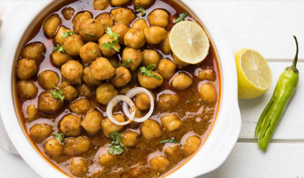 Chana Masala Vegan Chana Masala Curry is a smooth Chickpea or Garbanzo beans curry cooked in onions spices, ginger turmeric cumin, garlic Nut & Gluten free