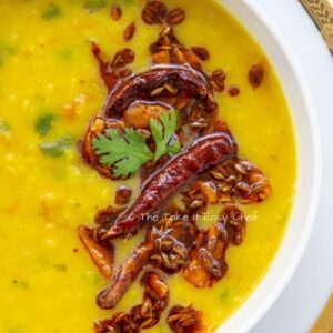 Gluten Free, Vegan Dal Tadka (Lentils)  are slow Cooked Lentil in a onion cumin tomato medley, enjoyed with Rice or Breads or both!